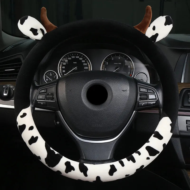 Plush car steering wheel cover in black and coffee colours showing protective handle feature