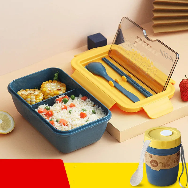 Green partitioned bento lunch box with four food compartments, shown open.
