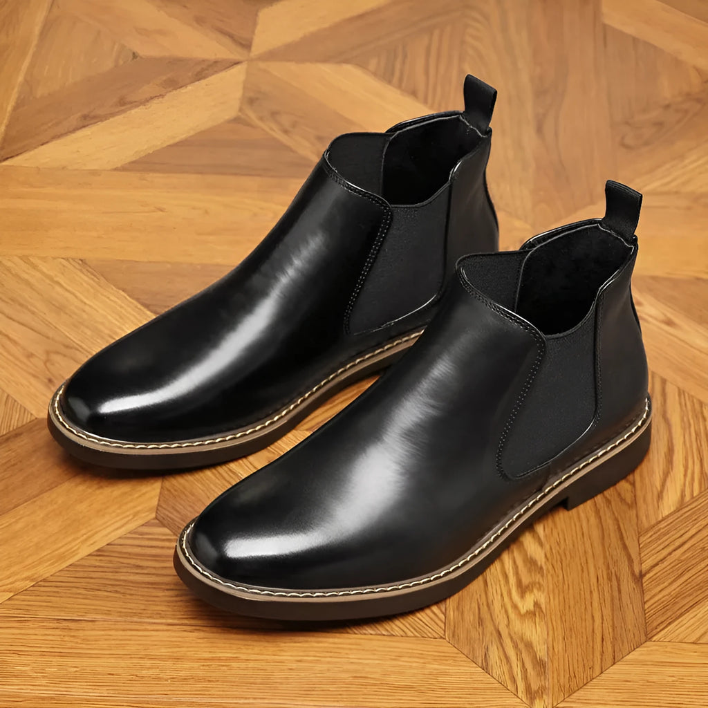 Men's black formal leather pointed-toe boots with a square heel on a white background.