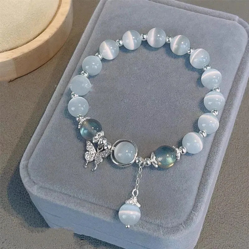 Chinese style glass bead bracelet with bamboo leaf design and manual craftsmanship details.