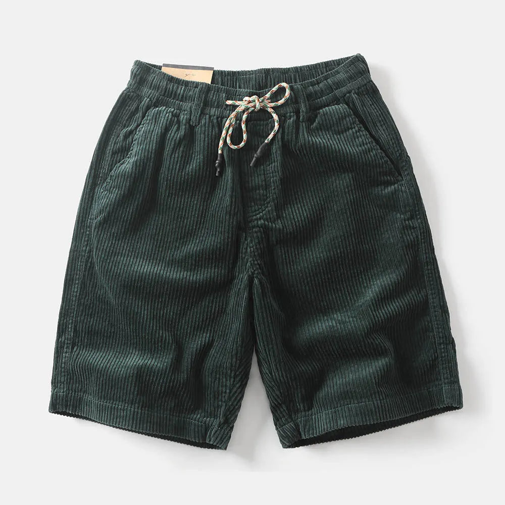 Man wearing khaki retro-style cargo shorts with straight leg and cargo pockets.