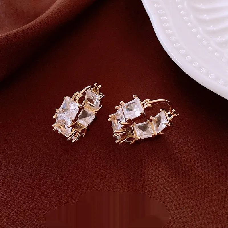 Gold-tone U-shaped ear clips with inlaid zircon and geometric quadrilateral design for women