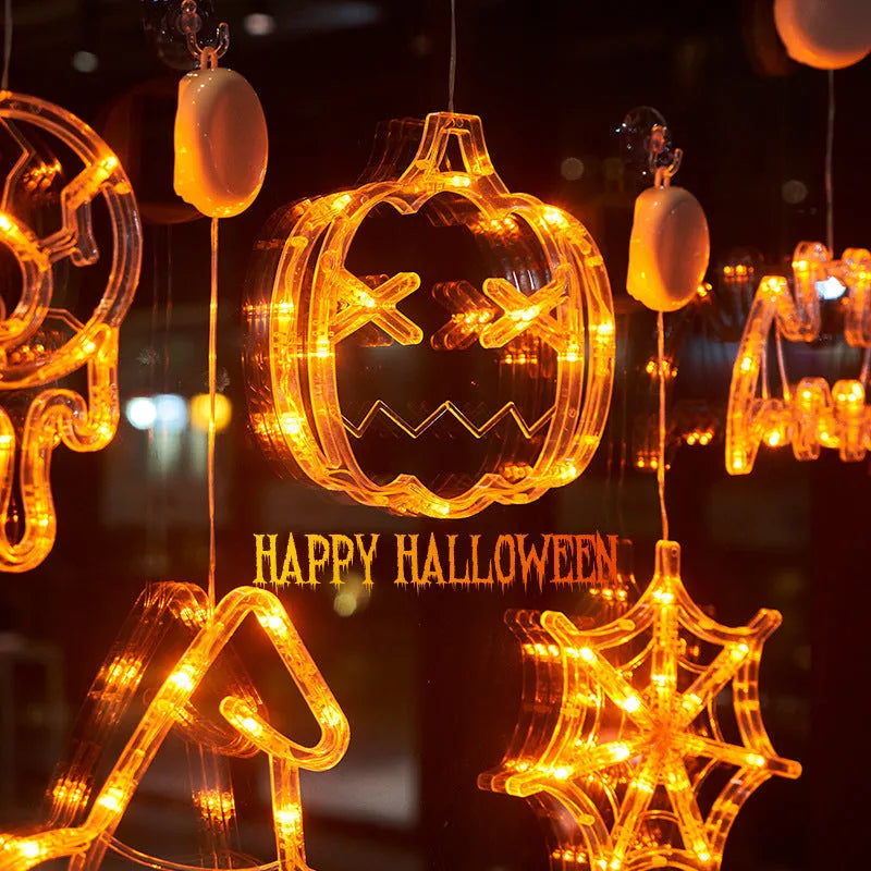 Seven Halloween LED window lights with spider, pumpkin, and ghost designs featuring suction cups for mounting
