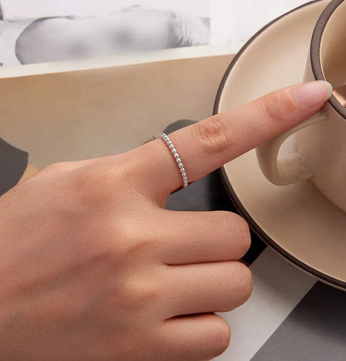 Silver bead ring with geometric shape and polka dot detail, stackable women's ring in sizes 6, 7, and 8.