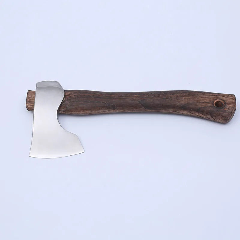Camping axe with a high-carbon steel head and a wooden handle on a neutral background