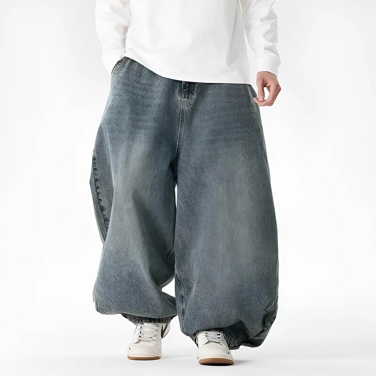 Man wearing plus size light blue wide leg baggy jeans, low waist straight leg casual style.