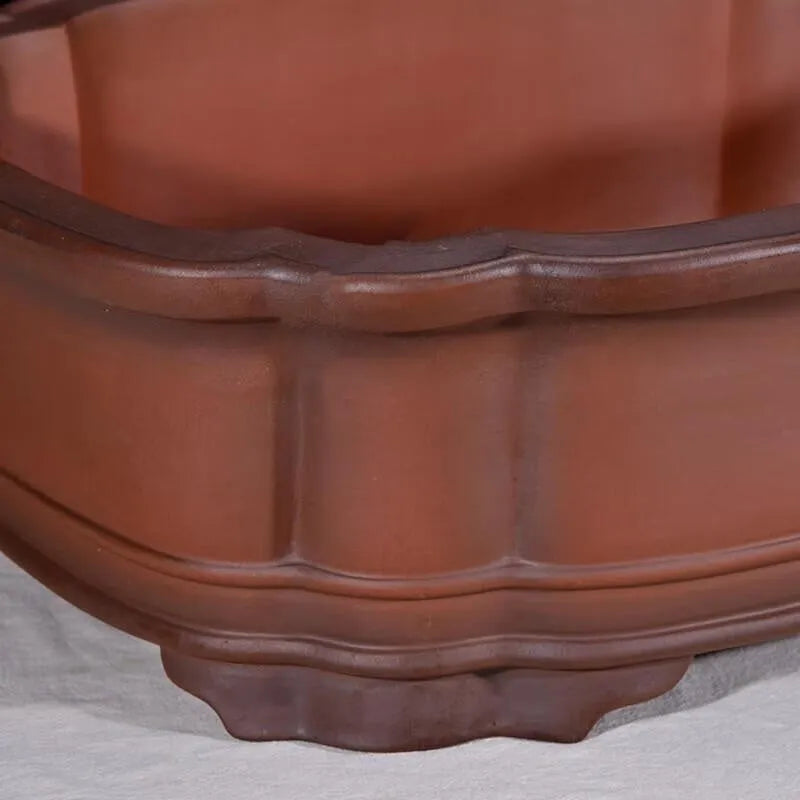 Large antique-finish purple clay Chinese style garden flower pot showing its size and deep planting cavity.