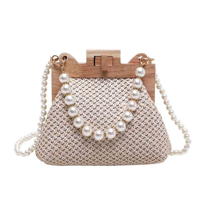 Women's straw shoulder bag with woven pearl chain detail and multiple internal compartments