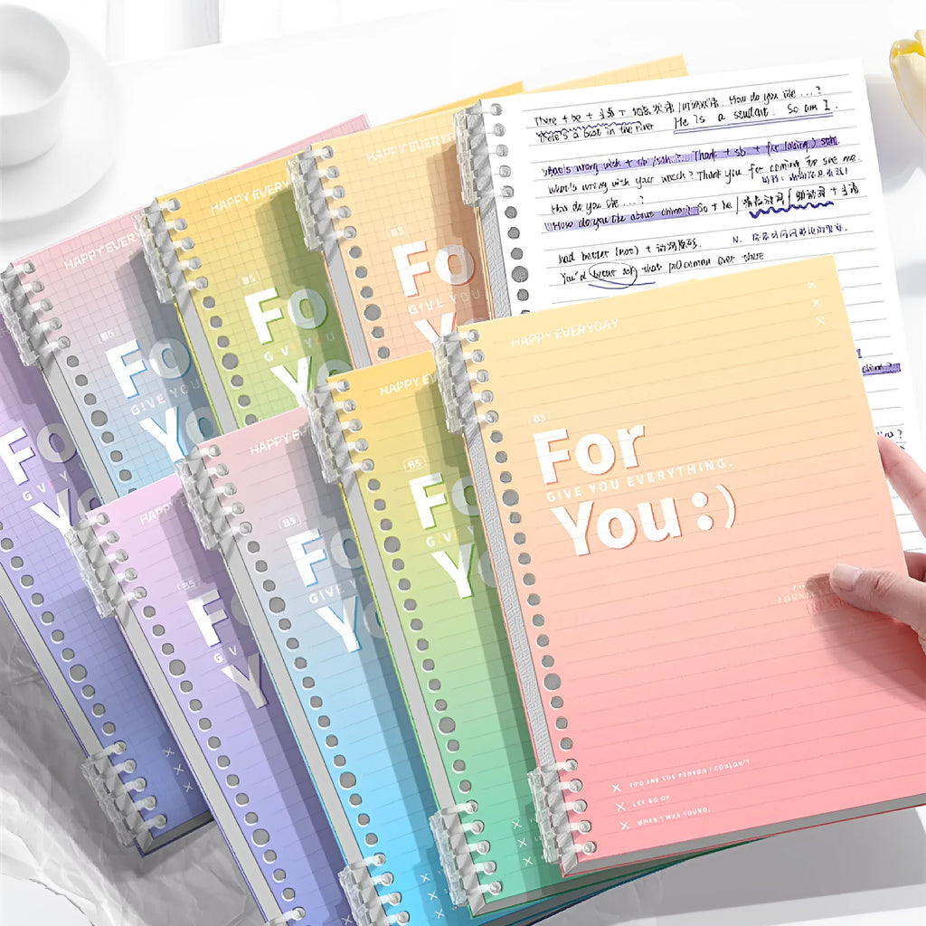 Removable coil gradient notepad in blue, green, pink, or purple, showing A4 and B5 sizes.