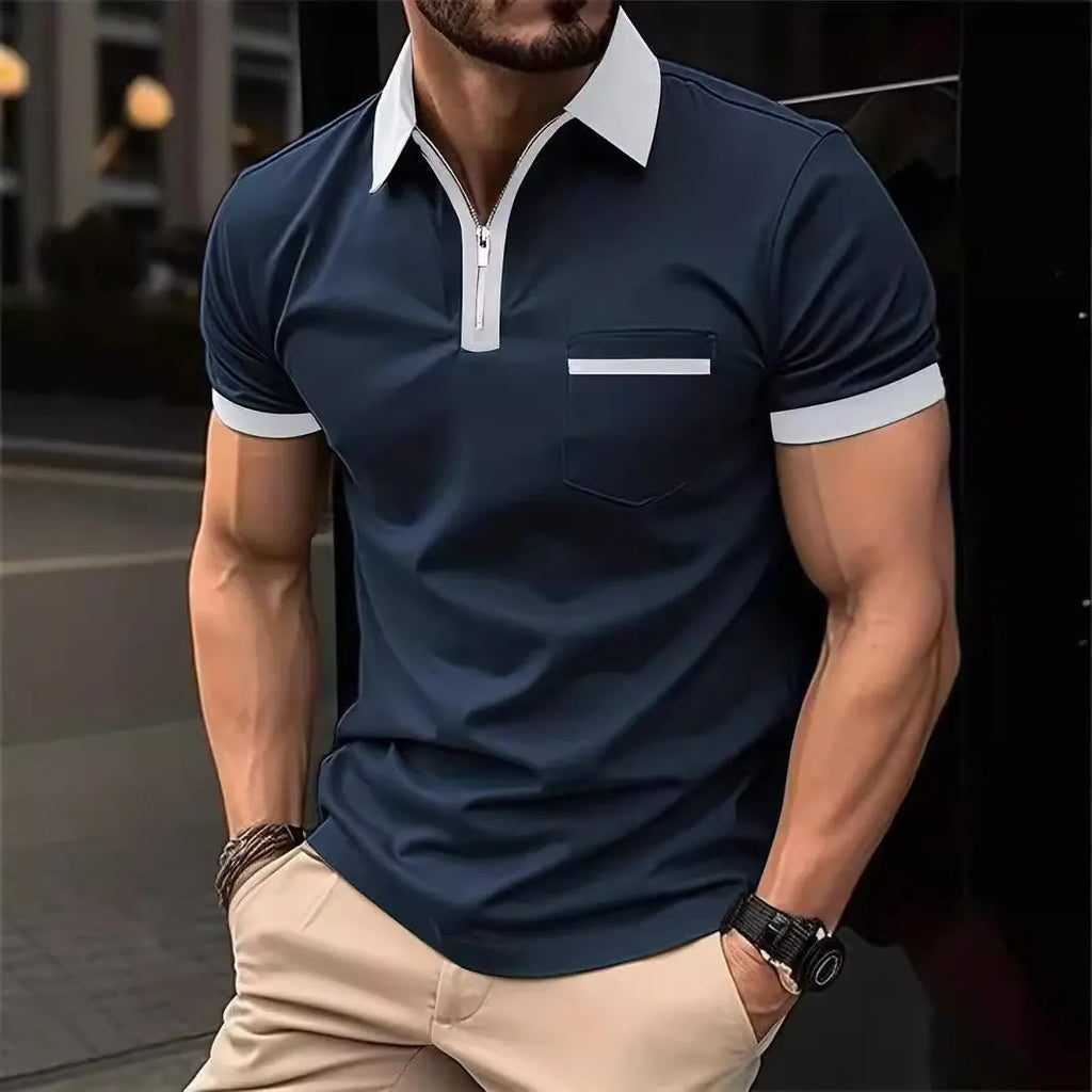 Man wearing a loose-fit casual short-sleeved shirt with a chest pocket and zipper decoration details.