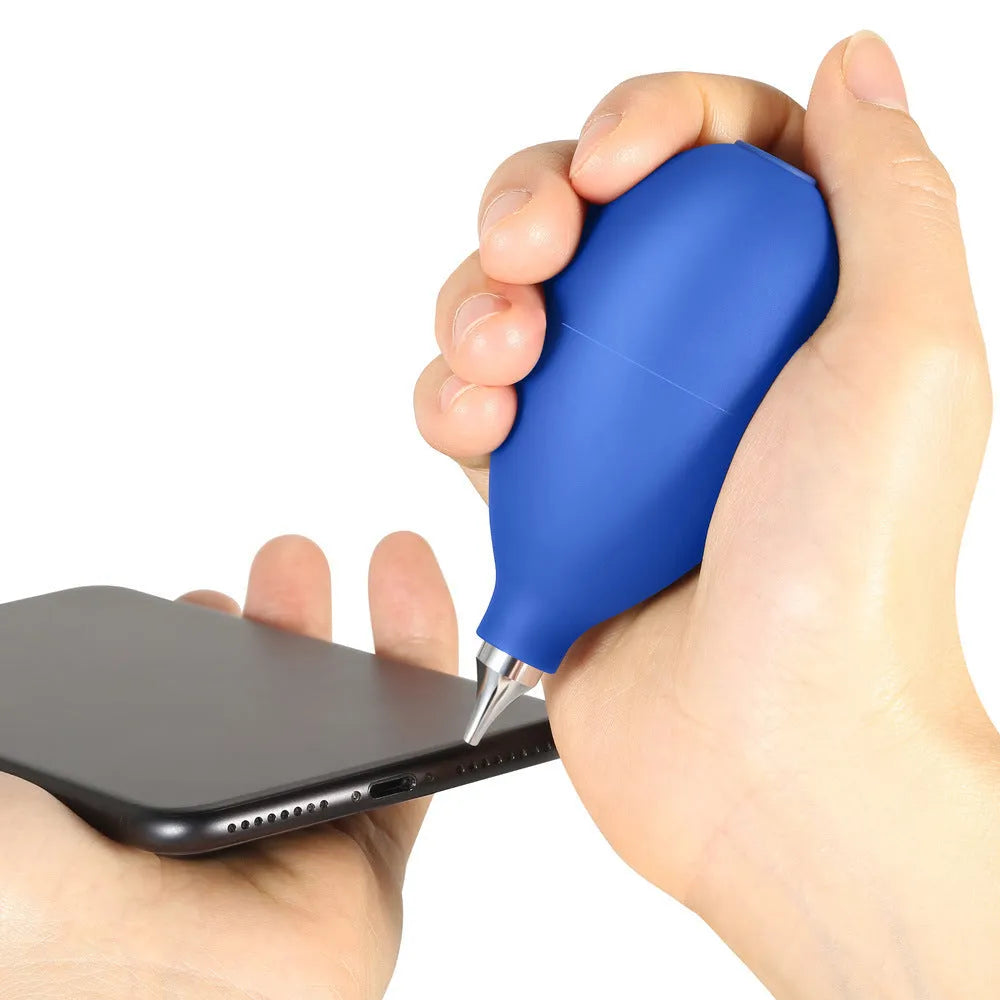 A compact black rubber dust blower with a bulb and nozzle for cleaning cameras and phones.