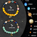 Set of twelve natural stone beaded bracelets, each representing a different zodiac sign.