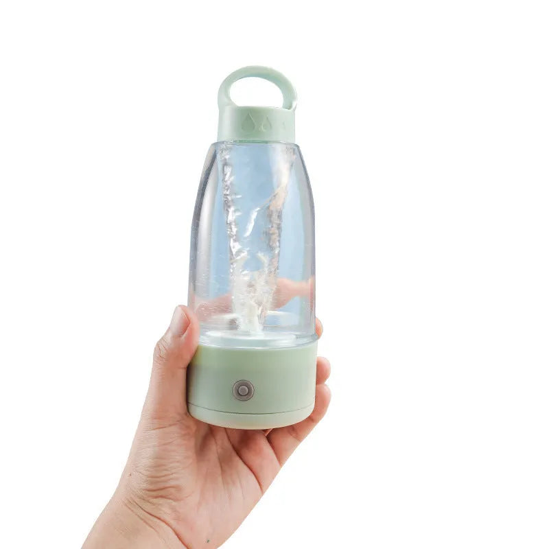 Automatic electric shaker bottle with USB port, handle, and blending blade in green, pink, or white.