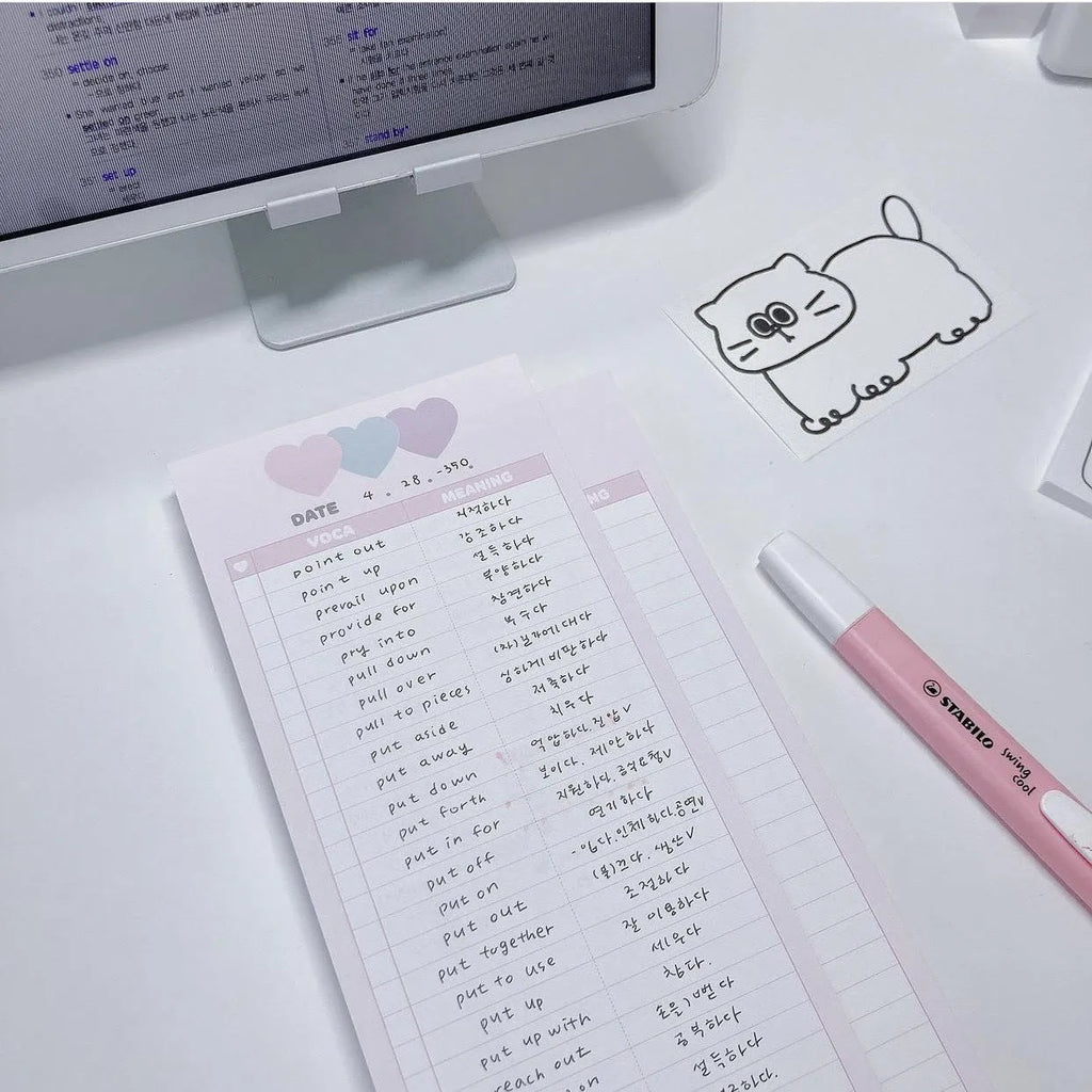 Blue B5 half-size vertical notepad with 30 sheets next to pink and purple versions.