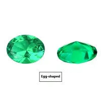 Selection of cultivated Columbia green emerald gemstones in various shapes and sizes on a white background.