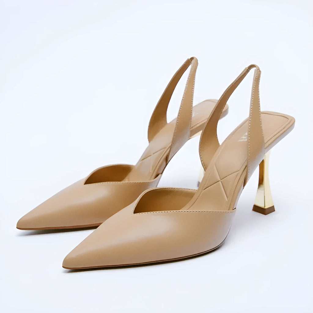 Nude patent leather pointed high heel shoe with shallow mouth, shown in apricot colour.