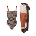 Women's dot print one-piece swimsuit with matching wrap skirt set