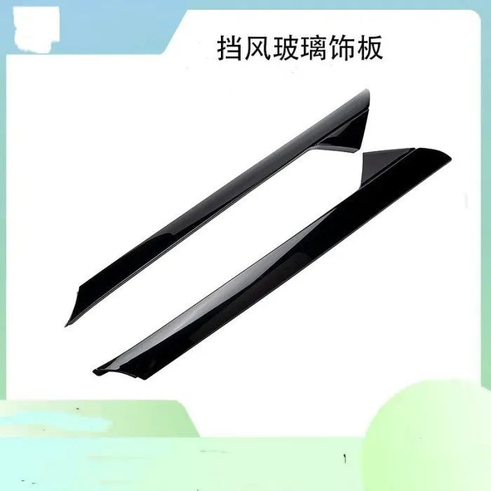 Black Ford front windshield decorative trim panel set, part numbers BB5Z-7803144-AA and BB5Z-7803145-AA.