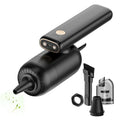 Black car charging vacuum cleaner with crevice nozzle and brush nozzle on a white background