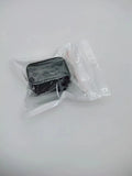 Black plastic seat belt lock catch protective device installed on automotive seat belt buckle
