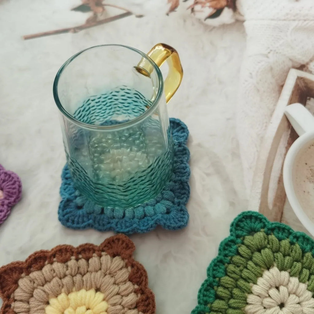 Handmade crocheted wool coaster with Grandmother Lattice pattern in Dream Purple colour.