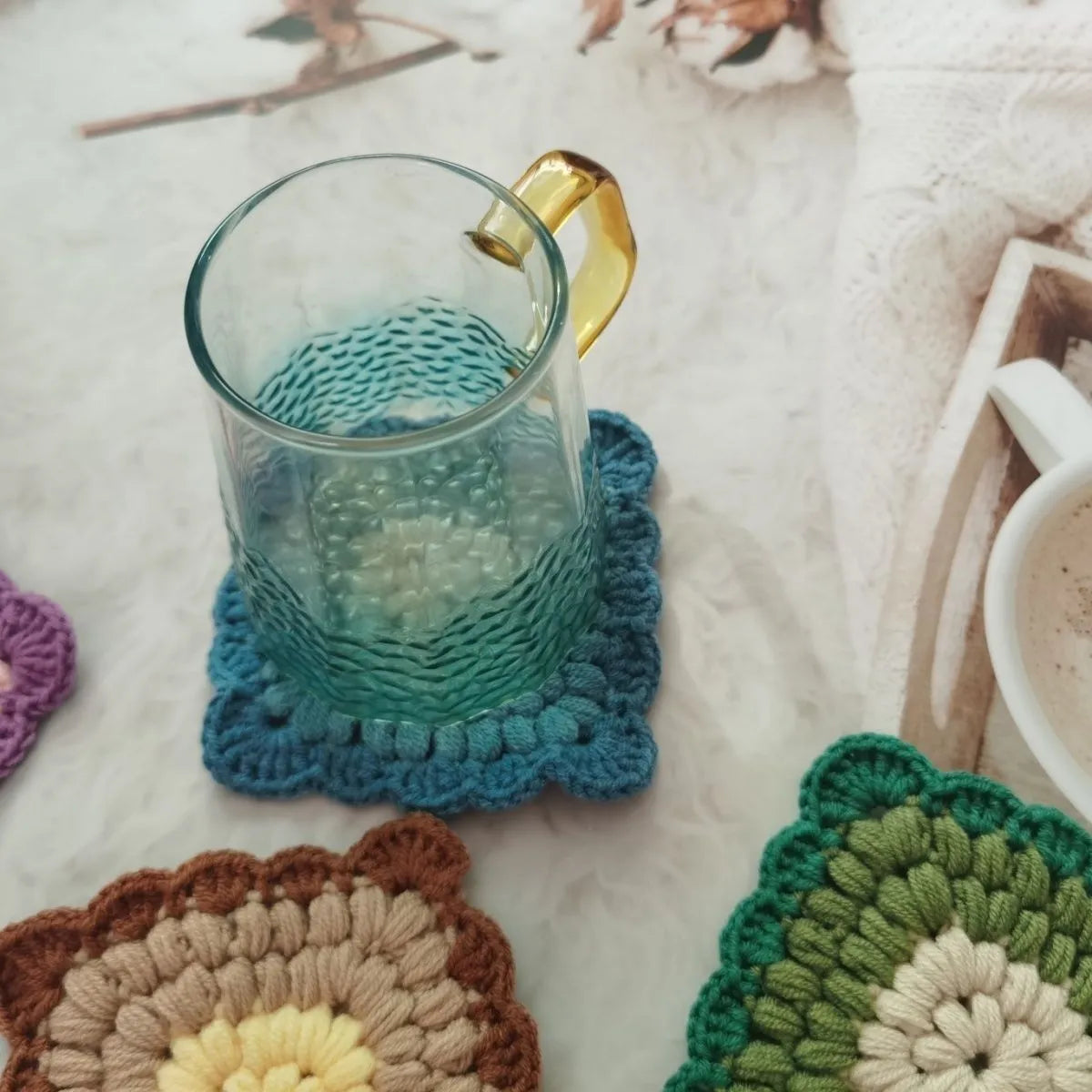 Handmade crocheted wool coaster with Grandmother Lattice pattern in Dream Purple colour.
