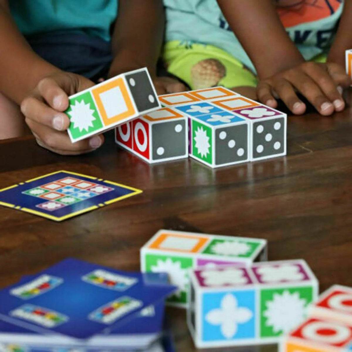 Spatial logical thinking board game with 20 coloured ABS blocks and 60 pattern cards in a colour box.