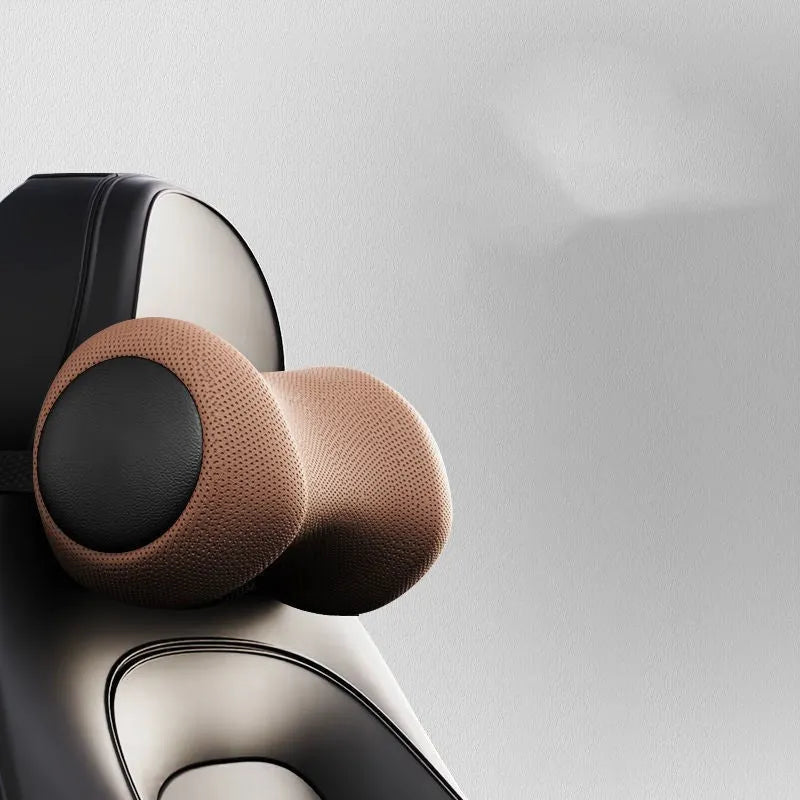 Car seat massage cushion and headrest set made from memory foam in a neutral colour.