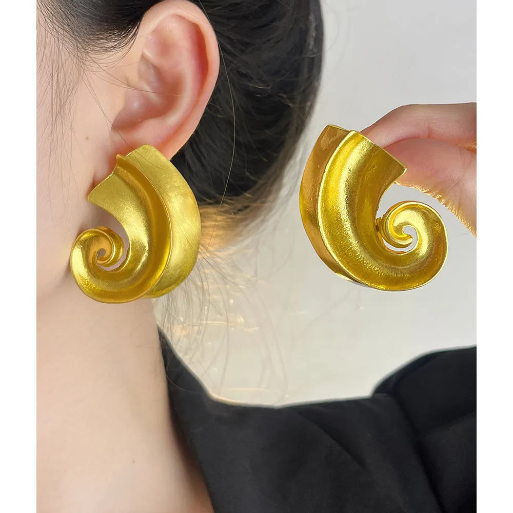 Geometric retro ear studs in gold and silver colours measuring 5cm with alloy construction