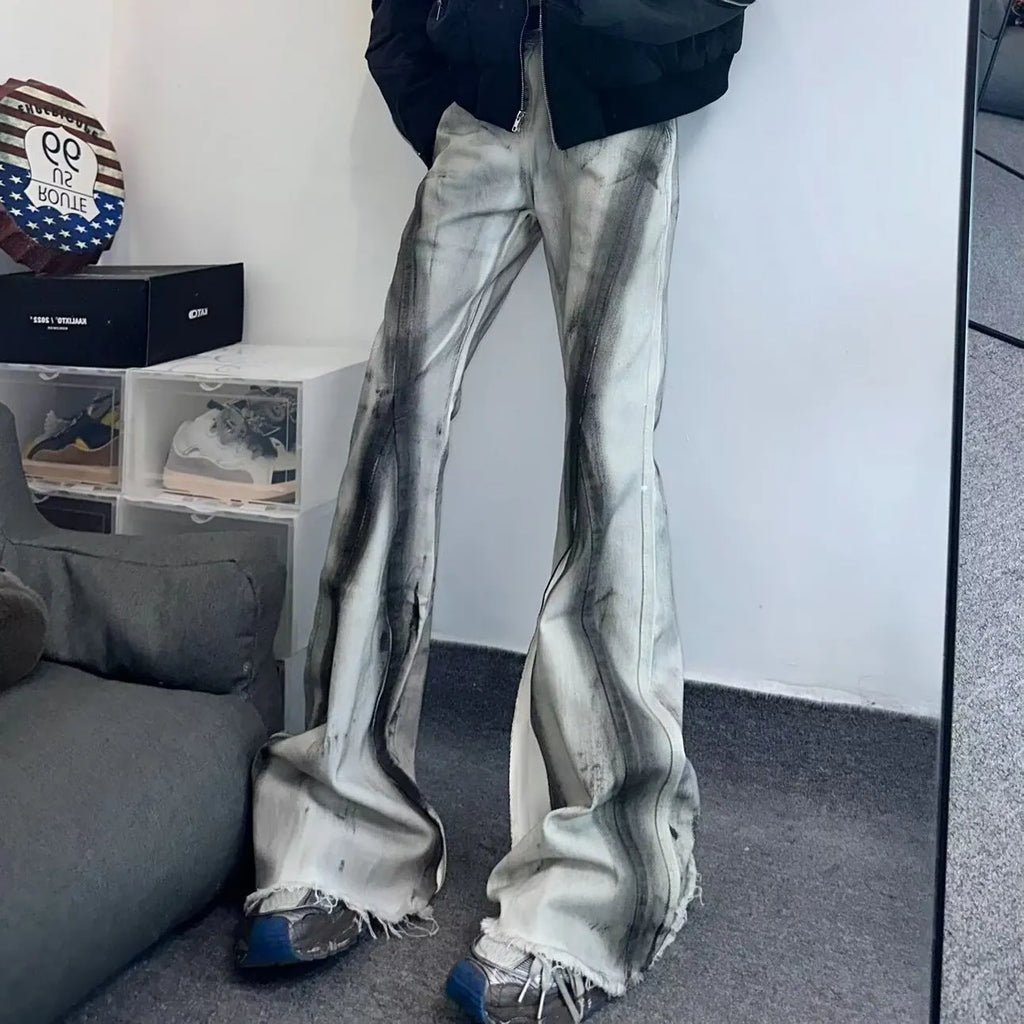 White heavy rough selvedge denim jeans with black ribbon gradient detailing, mid waist, zip fly.
