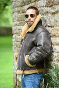 Men's brown synthetic leather fur coat with side pockets on a model