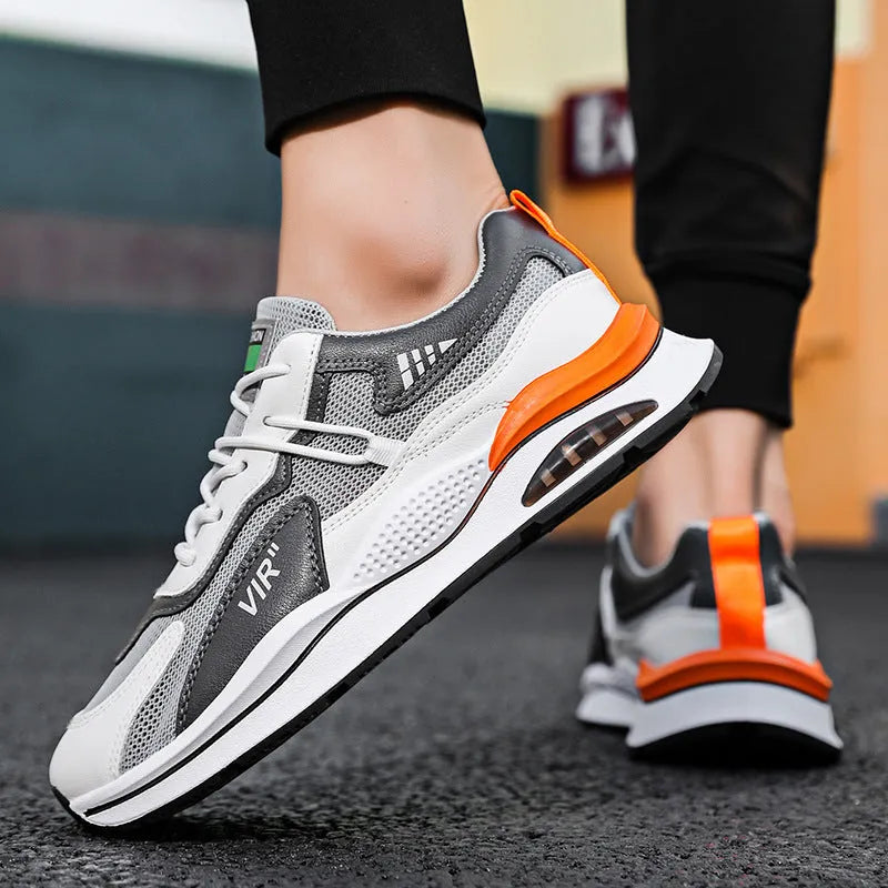 Men's grey mesh running shoes with round toe and middle top design on light background