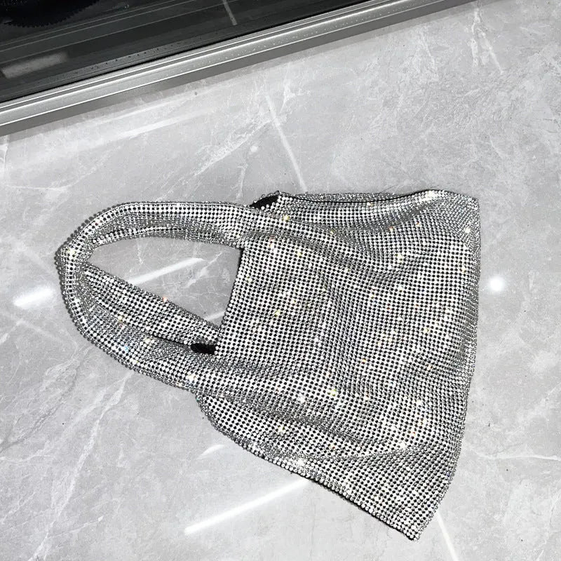Silver rhinestone handbag with cotton thread body and open outer pocket for dinner and party use