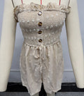 Blue off-shoulder sleeveless women's jumpsuit with button detail and cropped legs.