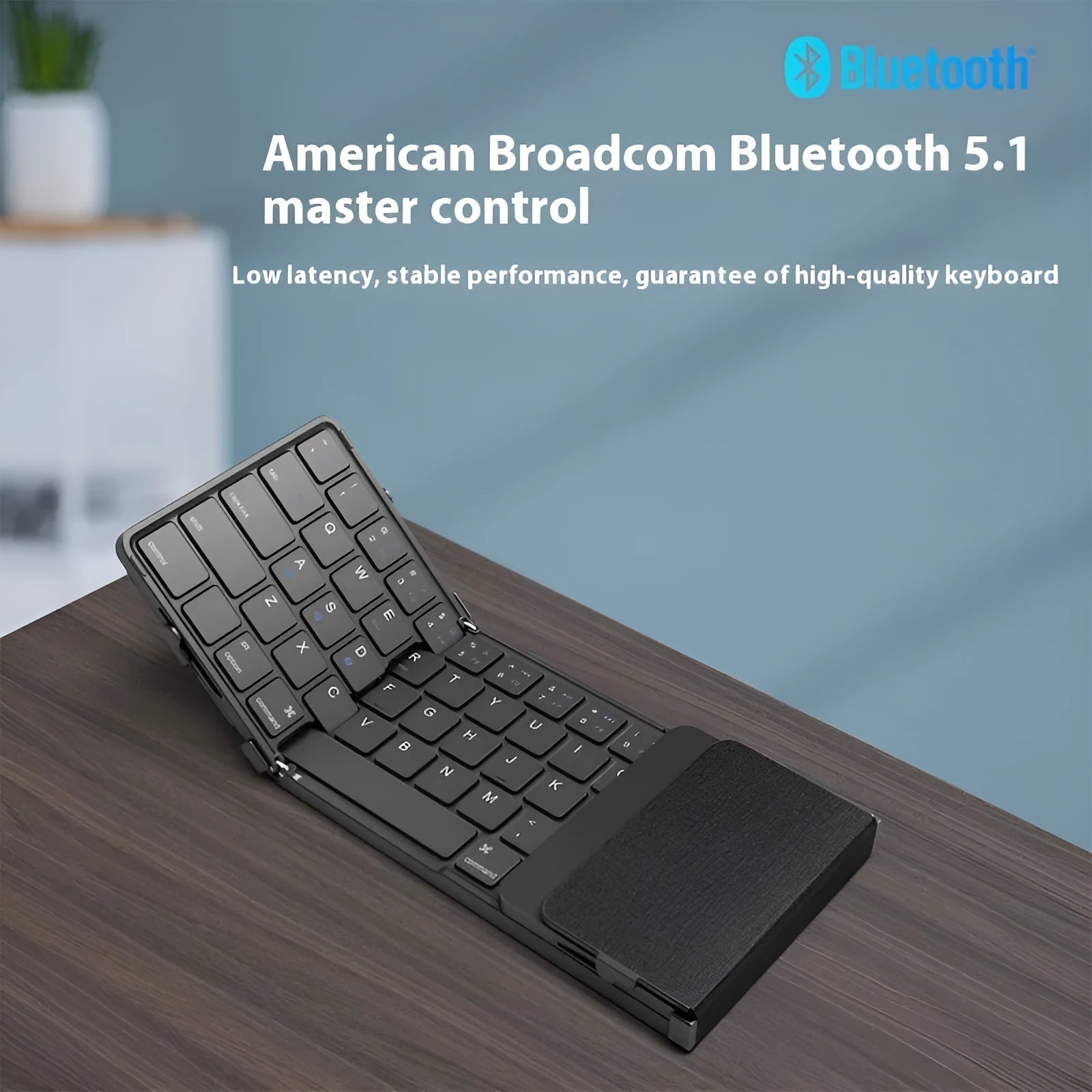 Black folding Bluetooth keyboard unfolded showing keys and touchpad option