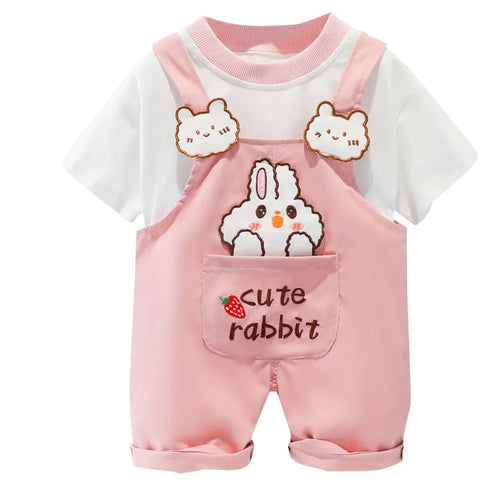 Baby wearing yellow cotton short-sleeved overalls with cartoon design and adjustable straps.