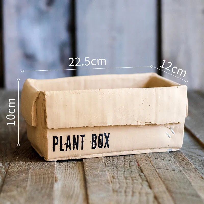 Cement flowerpot with paper carton aesthetic and drainage hole in Nordic style for indoor plants