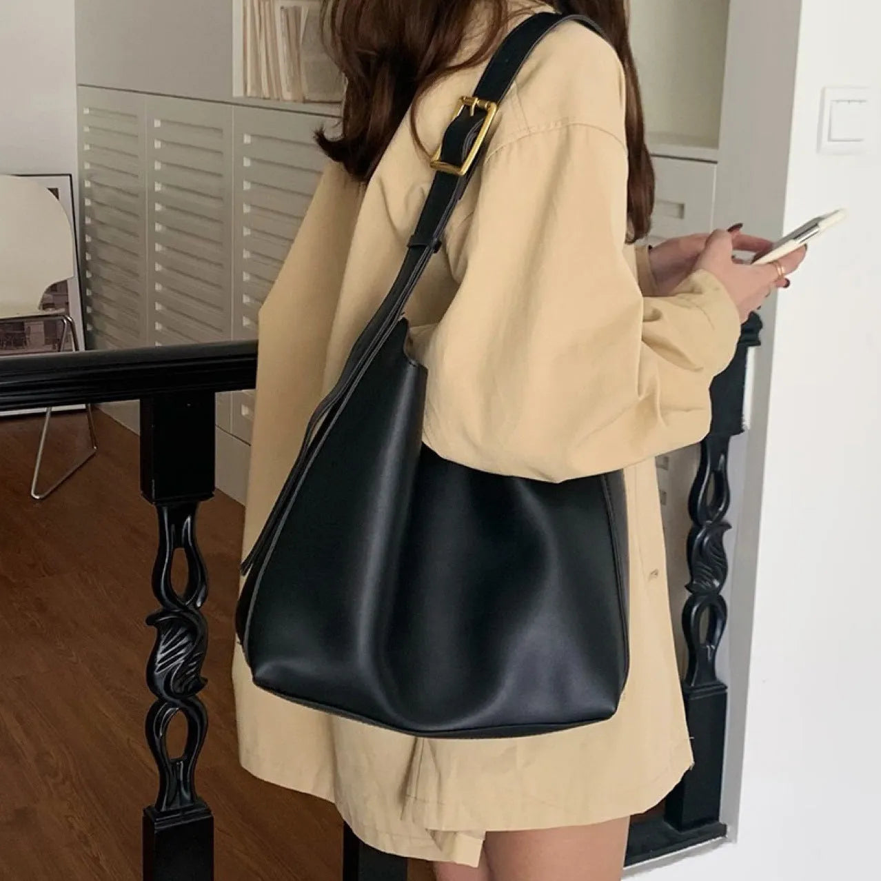 Ladies' shoulder bag with swing thread details in soft PU material showing black and brown colour options
