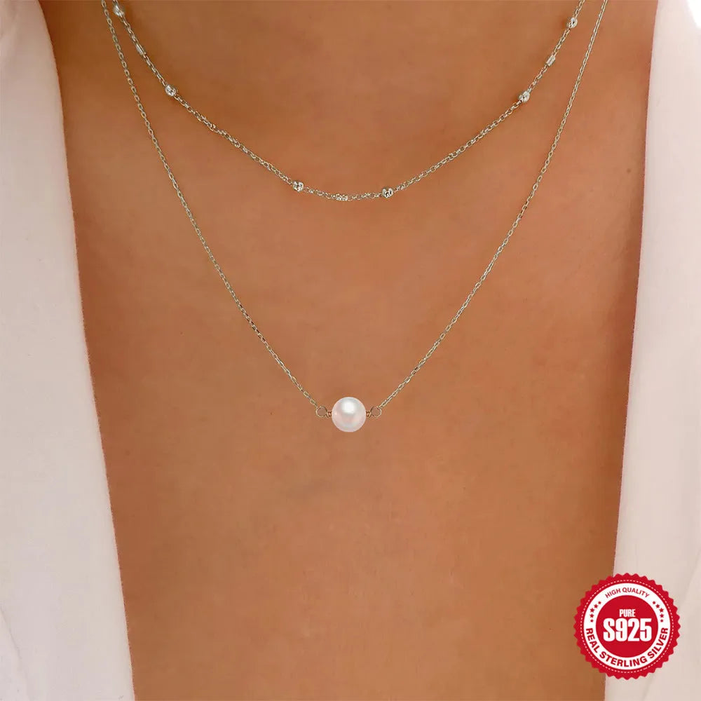 S925 sterling silver double layer women's necklace with geometric pearl pendant in gold or white gold.