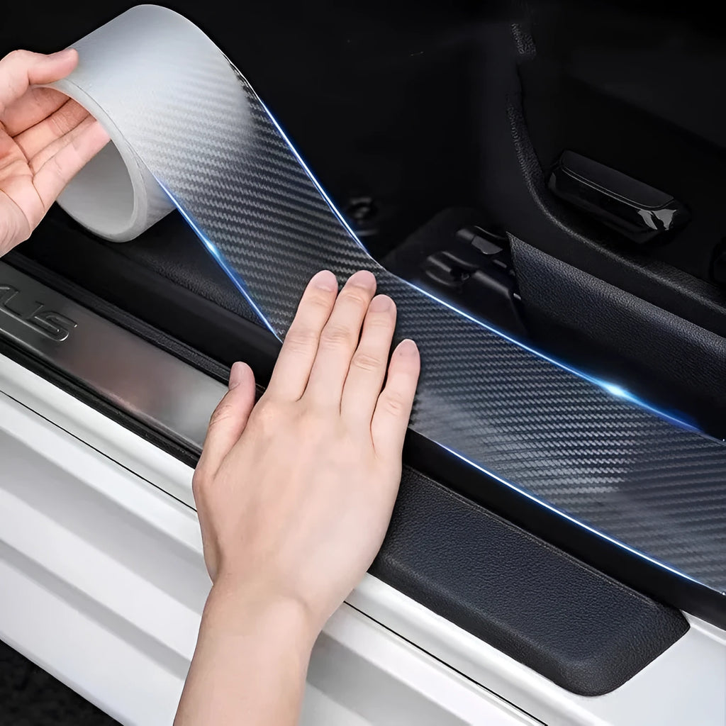 Roll of carbon fibre grain car protection strip with scraper and utility knife for door edge installation.