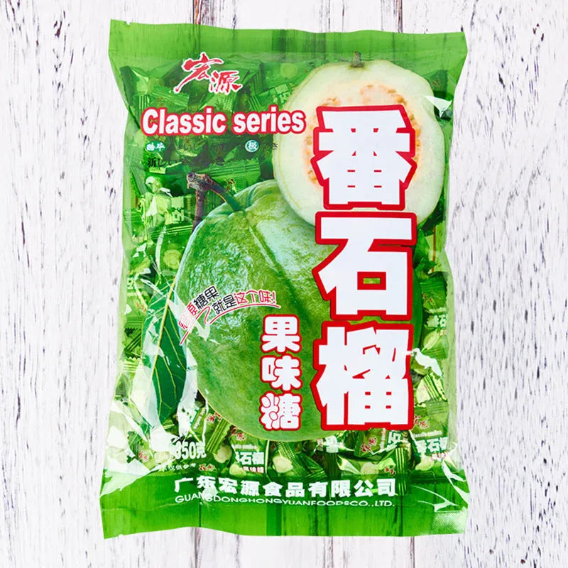 Assorted hard candies in plum, guava, and tangerine peel flavours in a bag.