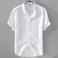 Man wearing a short sleeve apricot coloured loose-fit linen blend casual shirt.
