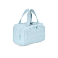 Large lightweight travel wash bag in pink with a wide-open zipper showing a fluffy interior lining.