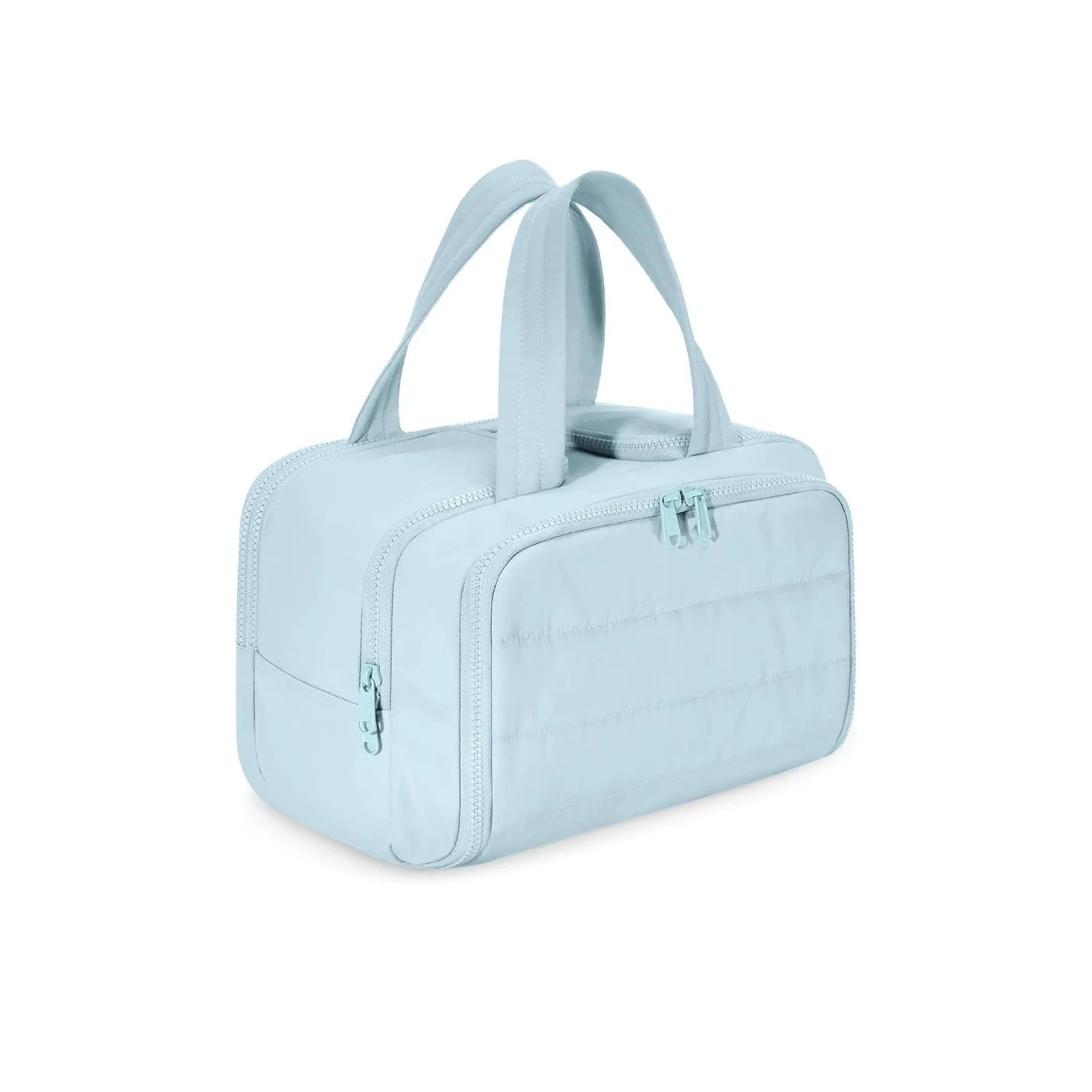 Large lightweight travel wash bag in pink with a wide-open zipper showing a fluffy interior lining.