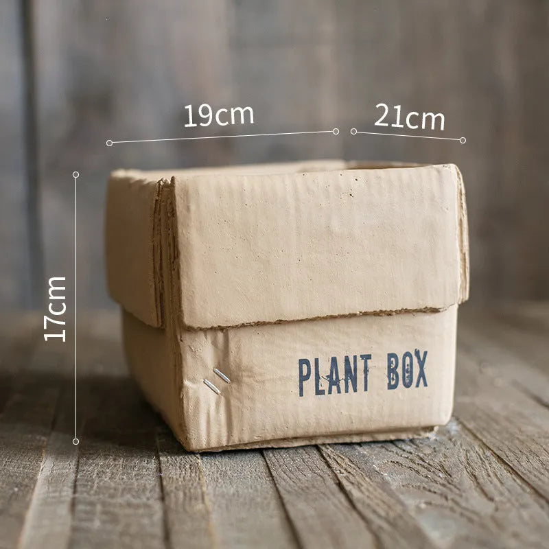 Cement flowerpot with paper carton aesthetic and drainage hole in Nordic style for indoor plants