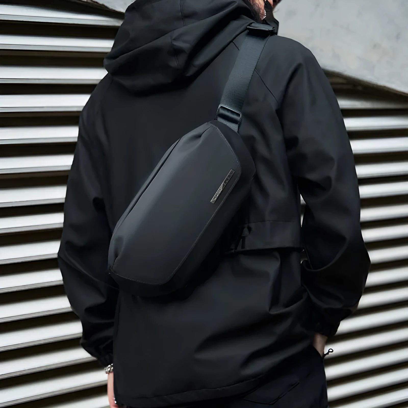 Black Oxford cloth men's crossbody messenger bag with a shoulder strap.