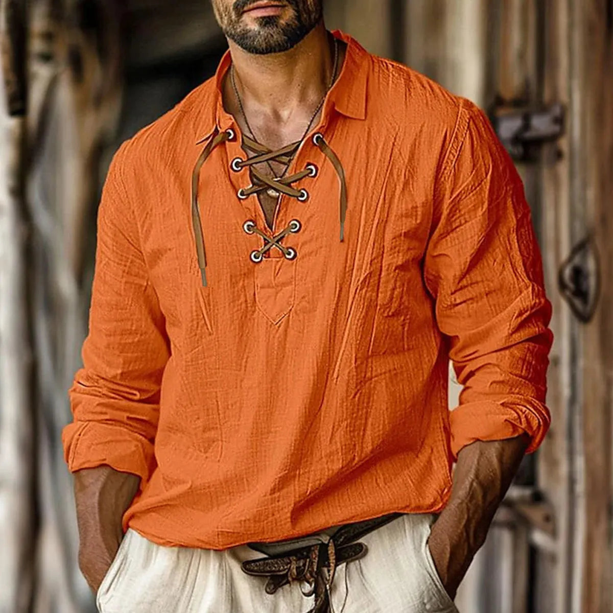 Men's loose-fit linen blend shirt in blue with lapels and lace detailing on the front.
