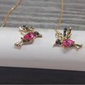 Women's long bird hanging earrings in alloy with blue electroplated finish.