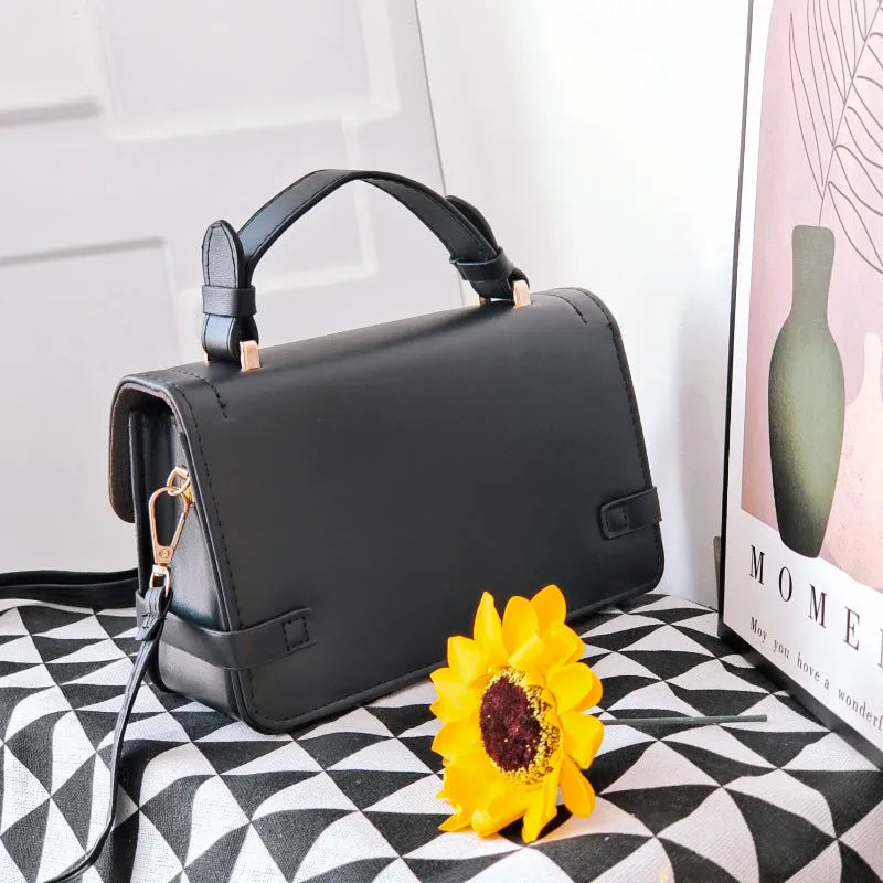 Retro patterned PU leather crossbody bag in a horizontal square shape on a white background.