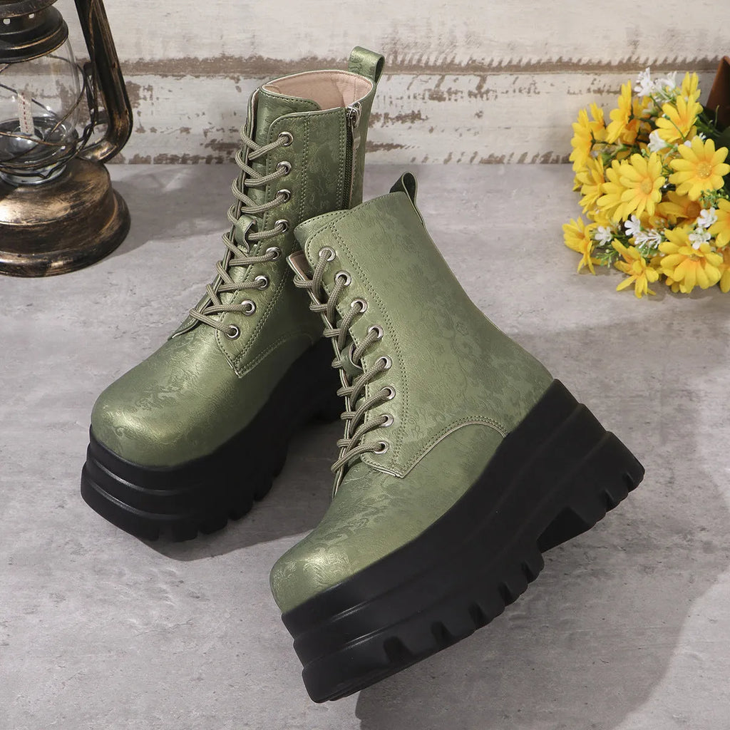 Women's black platform Martin boots with side zip and chunky rubber sole.